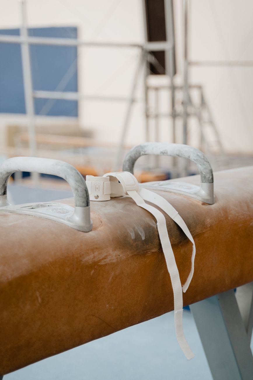 gymnastic wrist wraps on a pommel horse