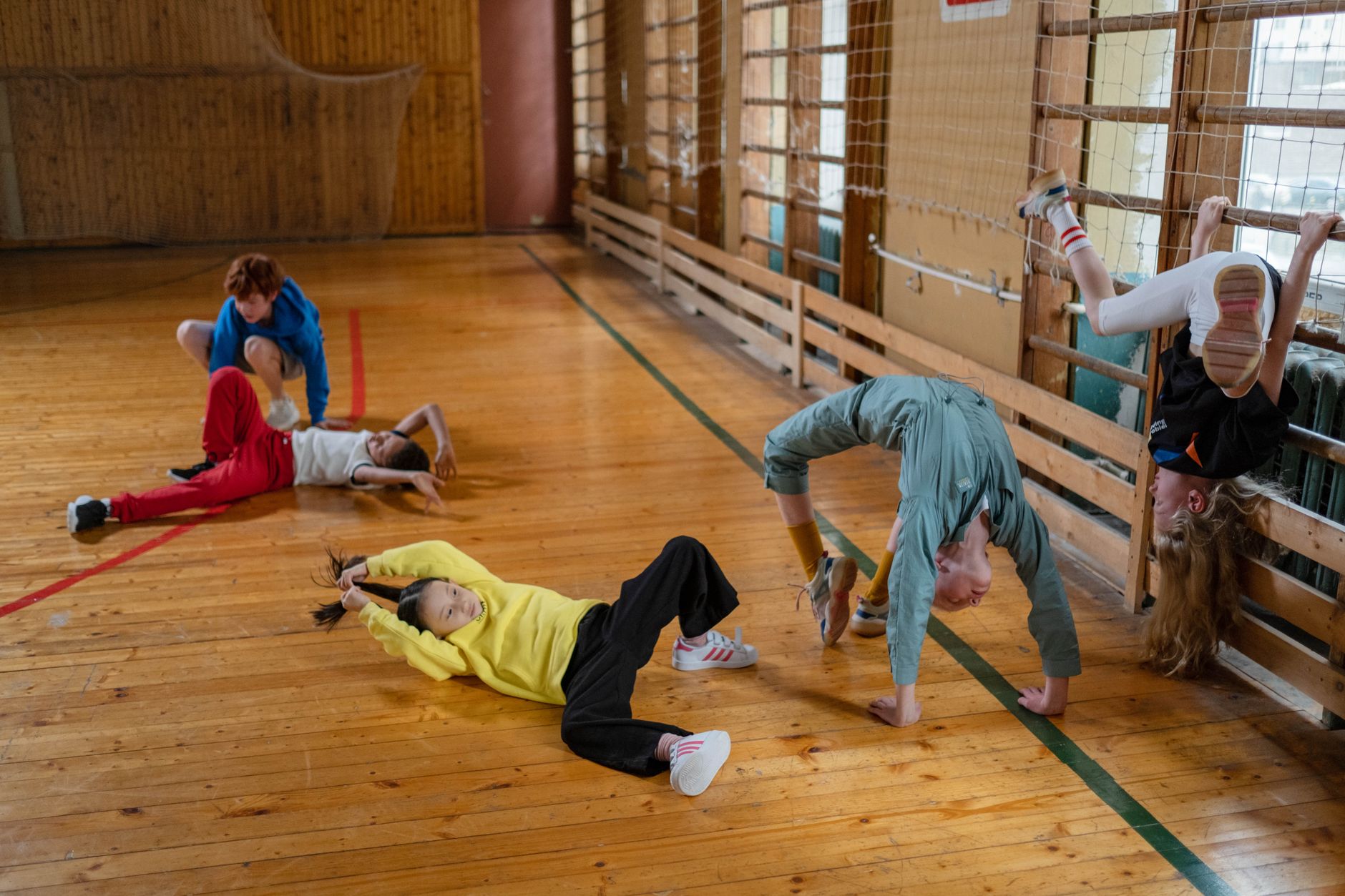 children having fun playing inside the sports hall